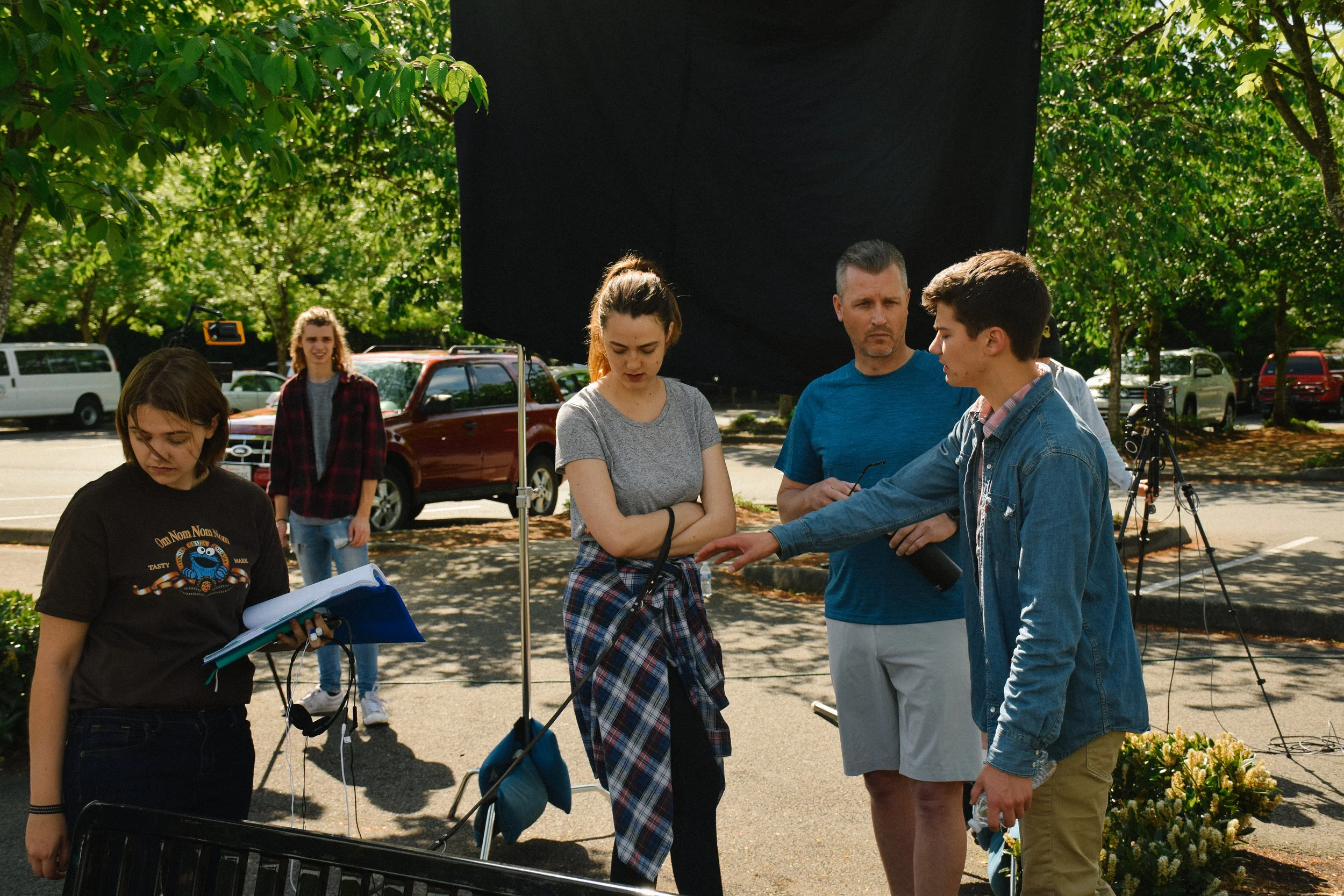 Director Colton Van Til directs his cast and crew on a location in Seattle, WA.