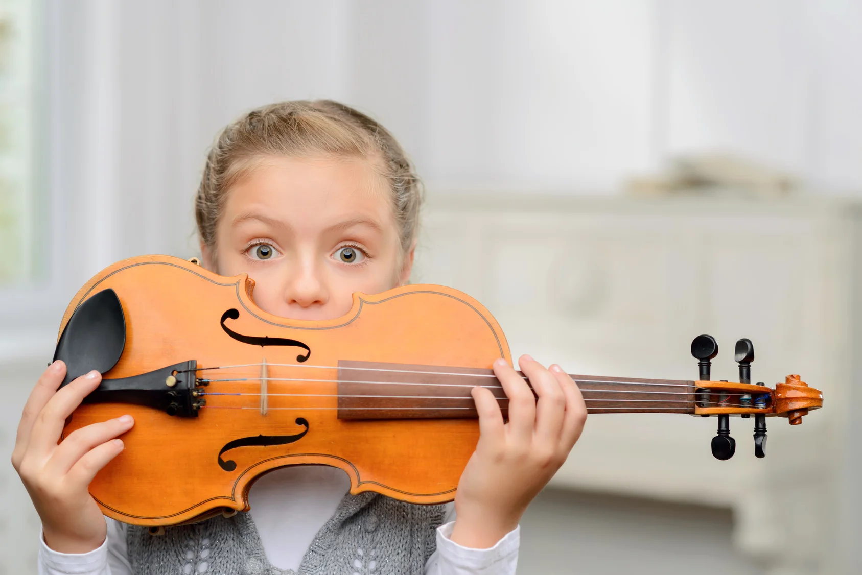 Girl Hides Behind Violin.jpg