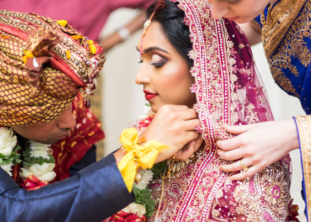 Umgeni Road Temple Wedding Photography groom tying thali