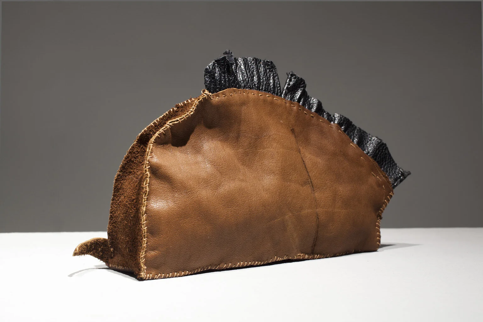 Figurine, 2013, Leather, syntheic leather, polyesters fiberfill, thread. 20cm x 18cm x 4 cm.