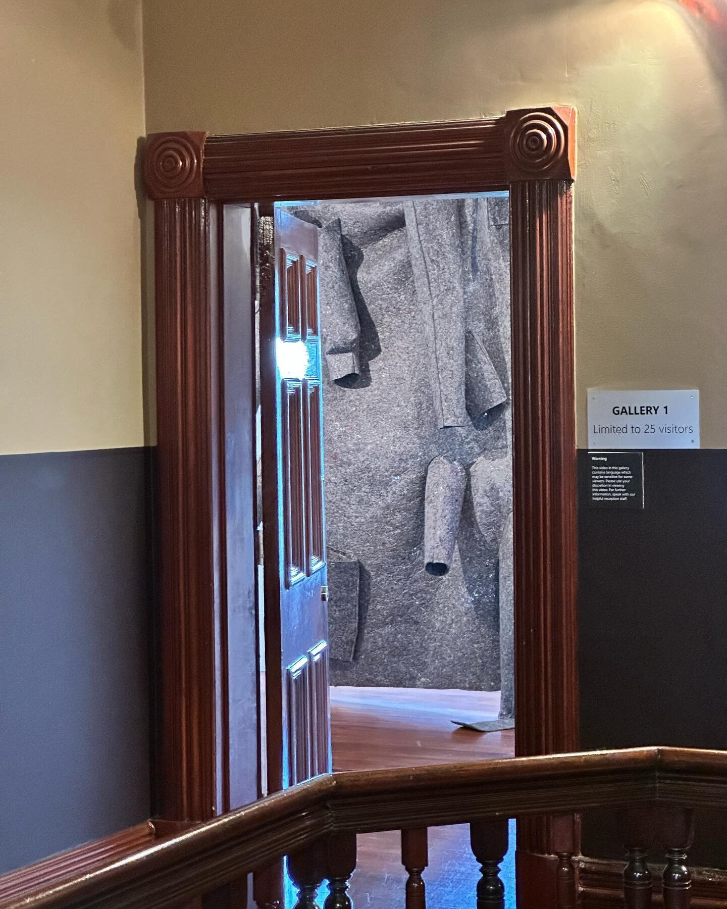 View of &lsquo;Felt in Time&rsquo; through doorway as part of the Darebin Art Prize.  Helvi Apted, &lsquo;Felt in Time&rsquo;, part of 'Coat of Arms' (series) 2023, manufactured felt, thread, polyester fiberfill, dimensions width 180cm x height 220cm