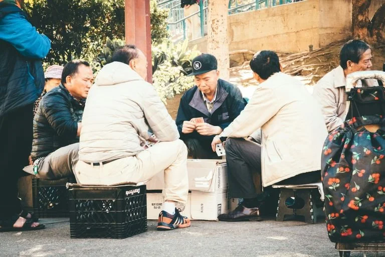 Group of friends reconnecting over games and activities is important for social and mental wellness