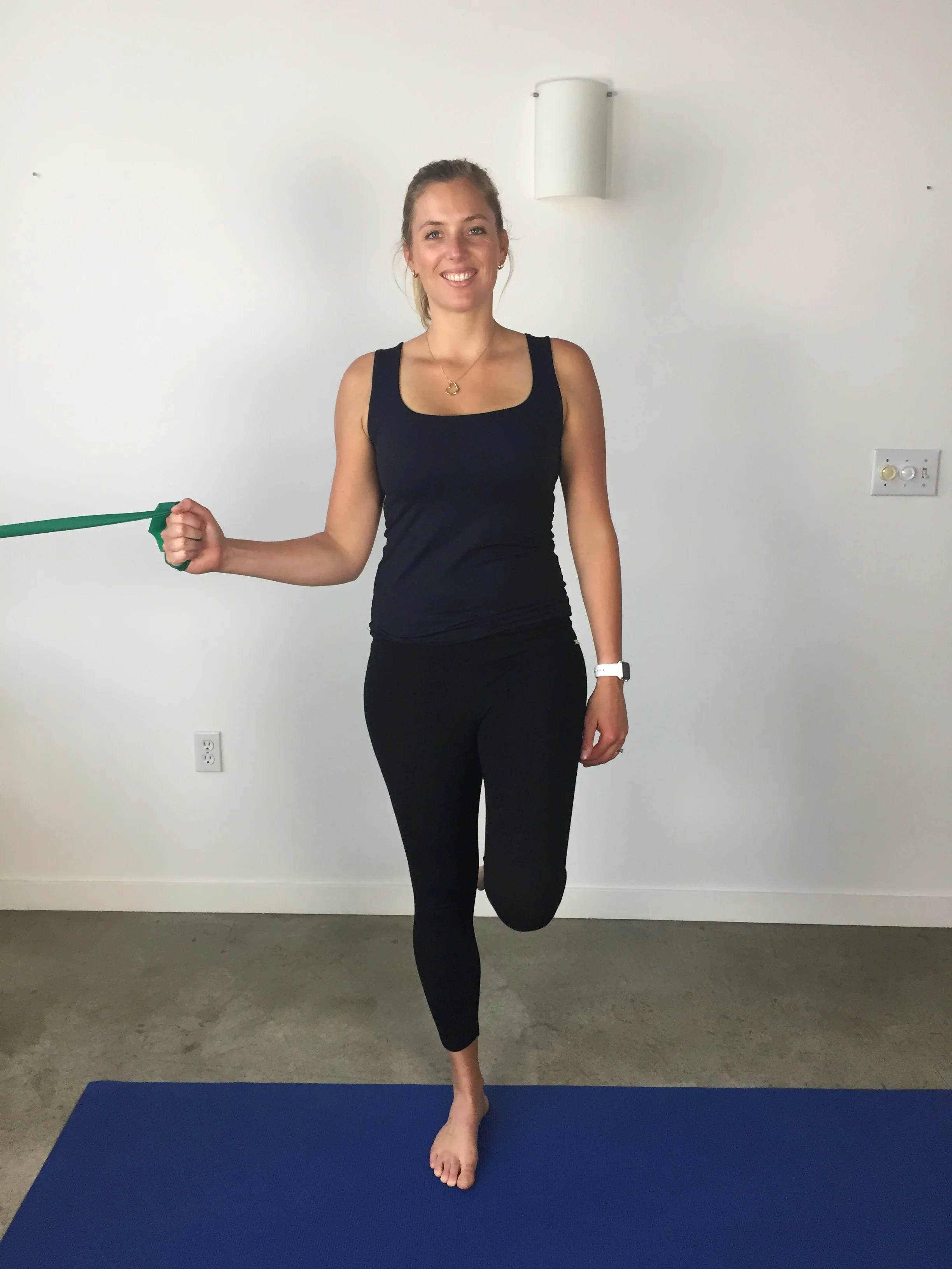 Single leg balance w theraband shoulder internal rotation - start position