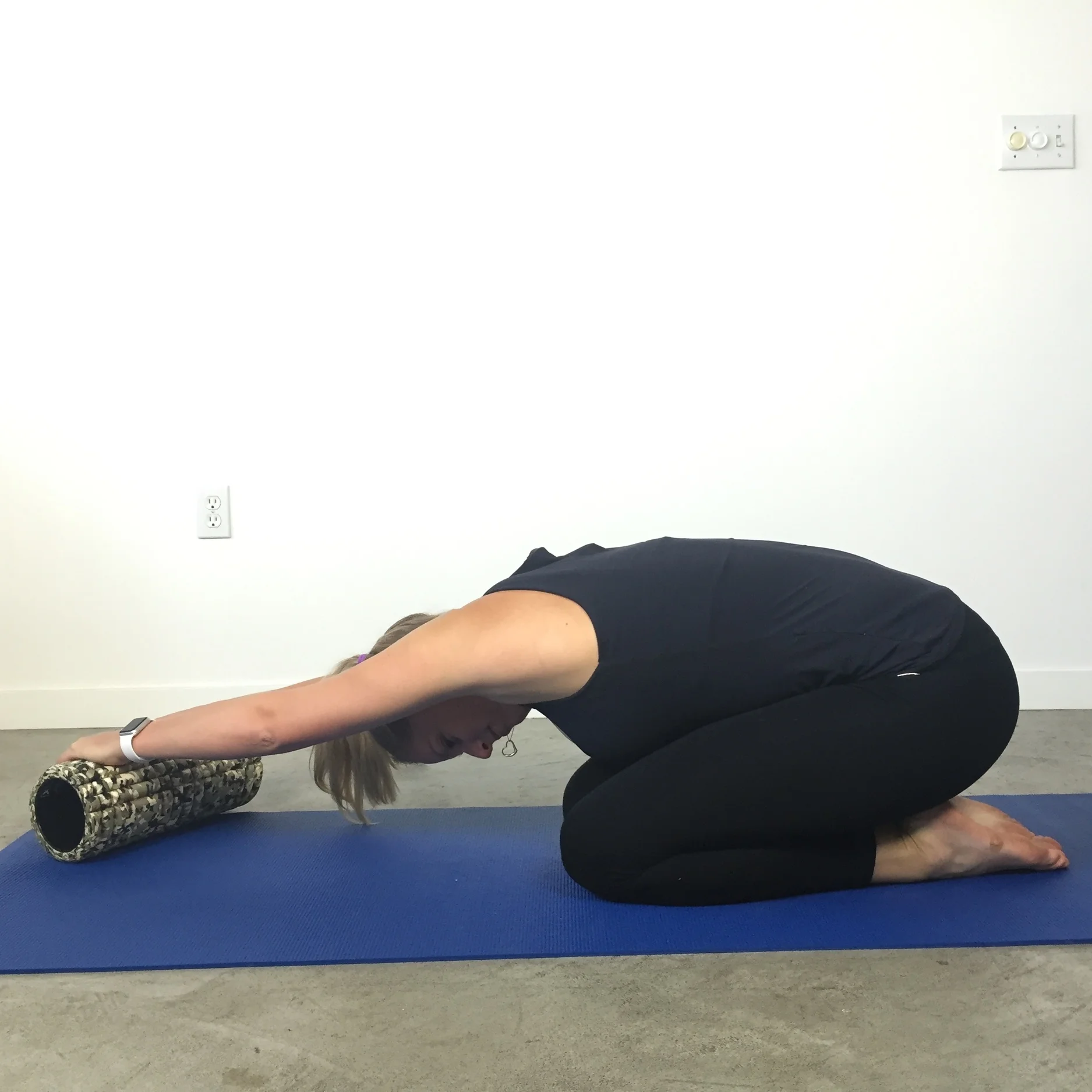 Child's pose stretch w foam roller x 1