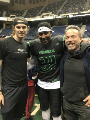 Outstanding Defensive back Maurice Thorne, with Float Zone staff member Grayson on left and co-owner Dr. David Berv on right, after another dominating game at the Richmond Coliseum.
