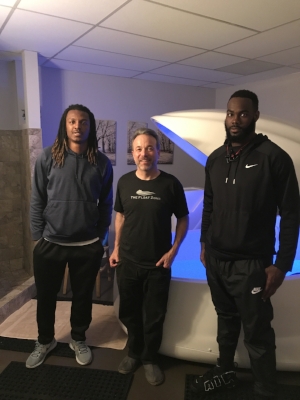 Dr. David Berv, float zone co-owner, in between star pro football defensive backs Quentin Hayes and Terrence Warren after their float at The Float Zone.