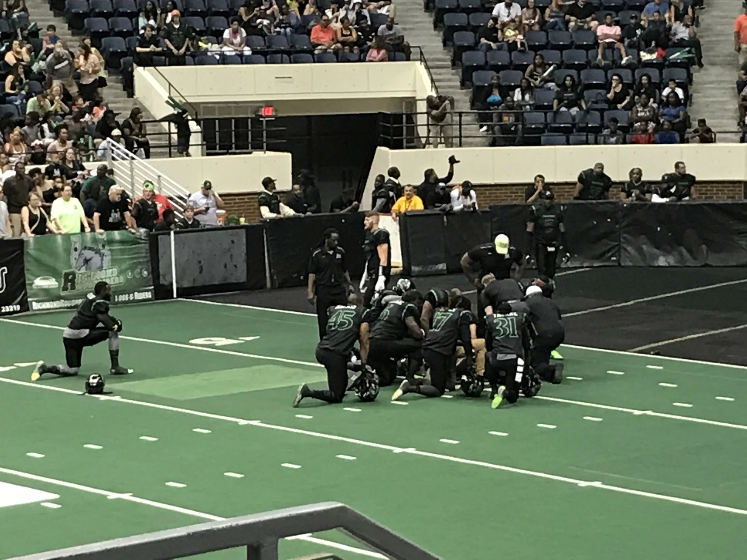 Here, the Rough Riders take a knee in support of their injured and only kicker. They had to modify their strategy with kickoffs, extra points and filed goals. Floating helps to repair injuries and to return to play more quickly.
