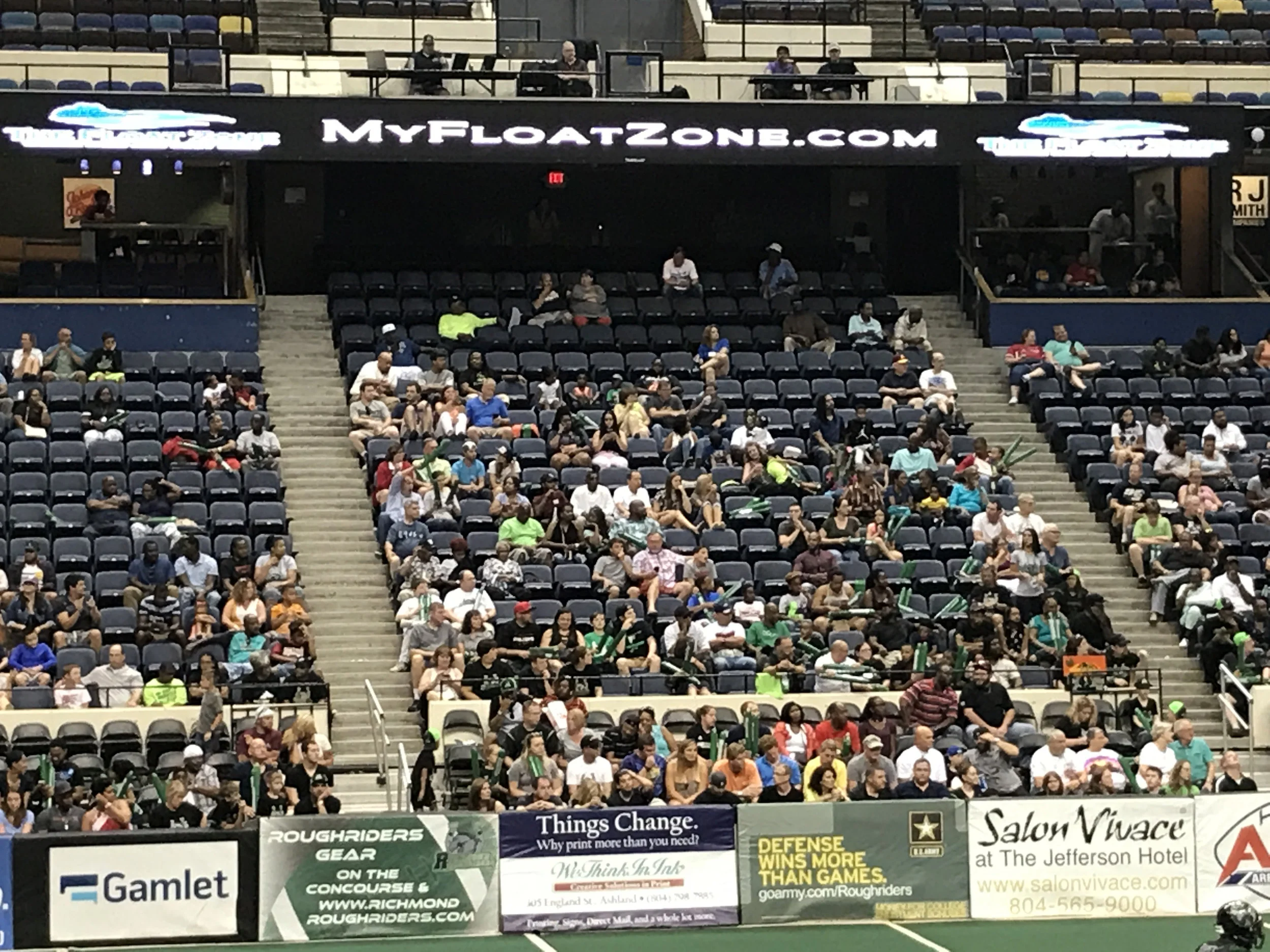  the first official float center for a professional sports team is shown on the screen In this photo. the announcer is also broadcasting about floating and pro football.