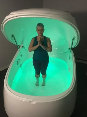 Gin Carter, yoga teacher and enthusiast, poses in a float tank at The Float Zone.