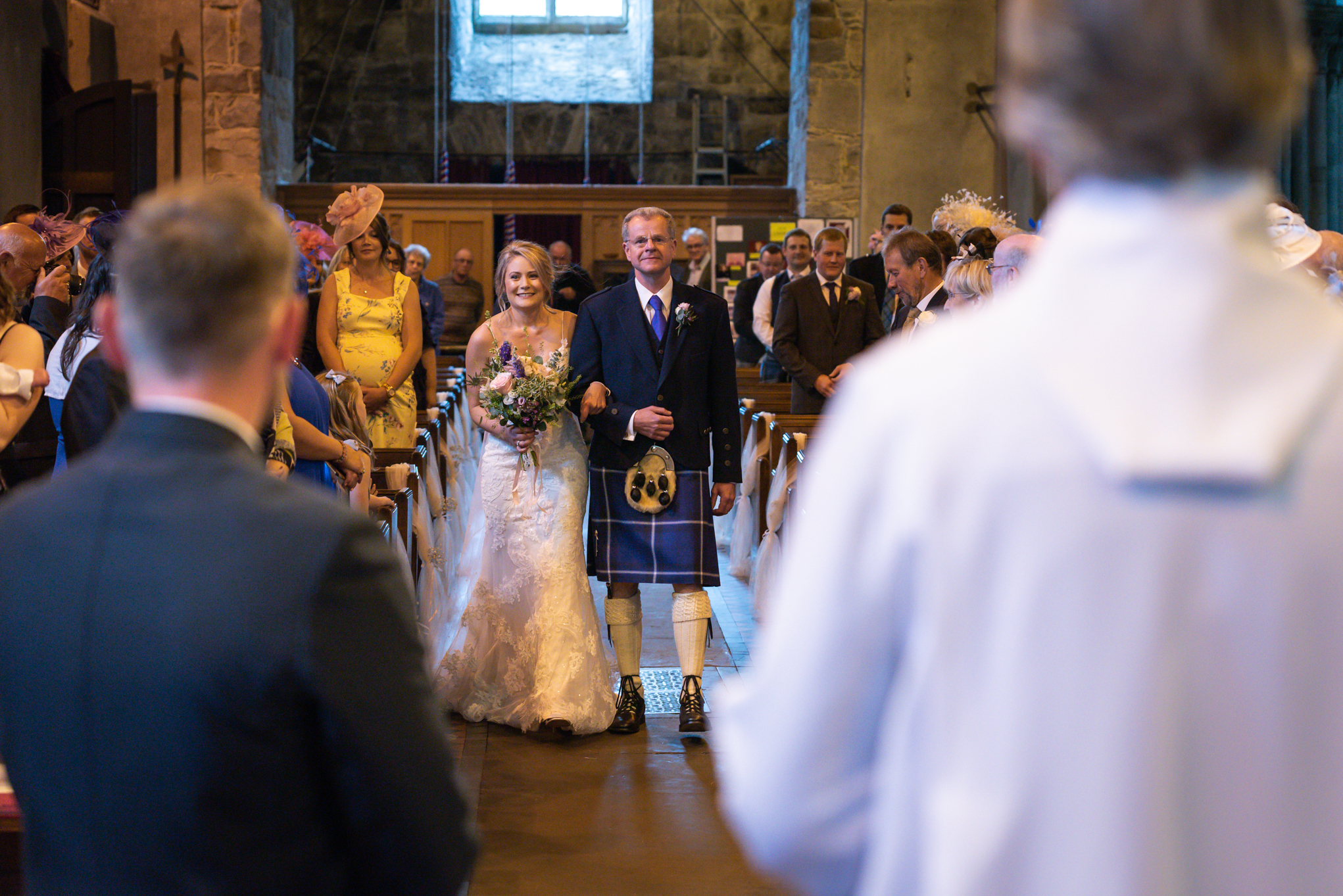bride walking down aisle Llanidloes church - Powys Wedding Photography