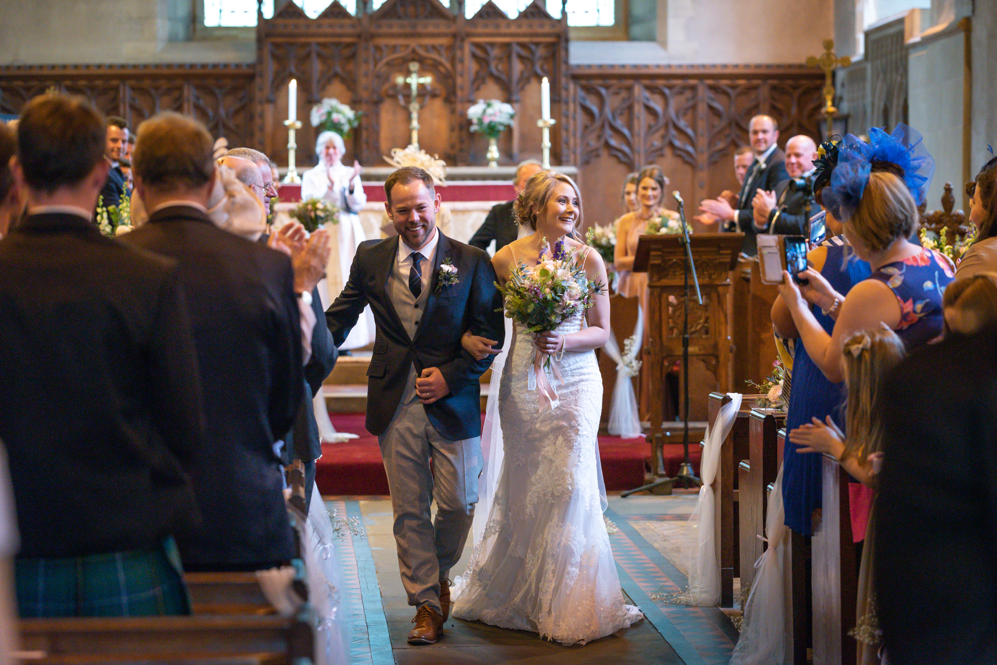 Bride and groom walking down aisle - Powys Wedding Photography