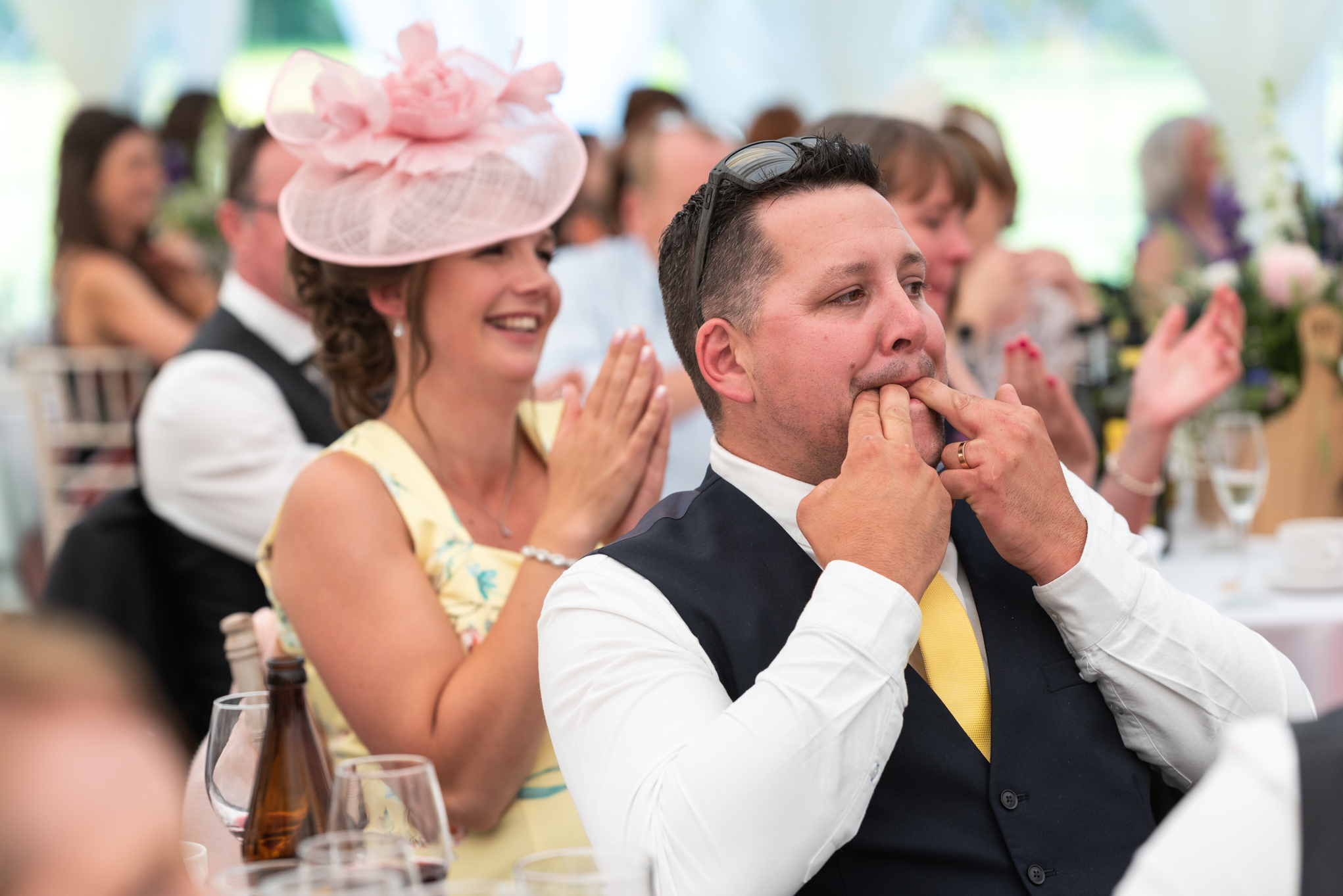 Guests laughing and whistling - Powys Wedding Photography