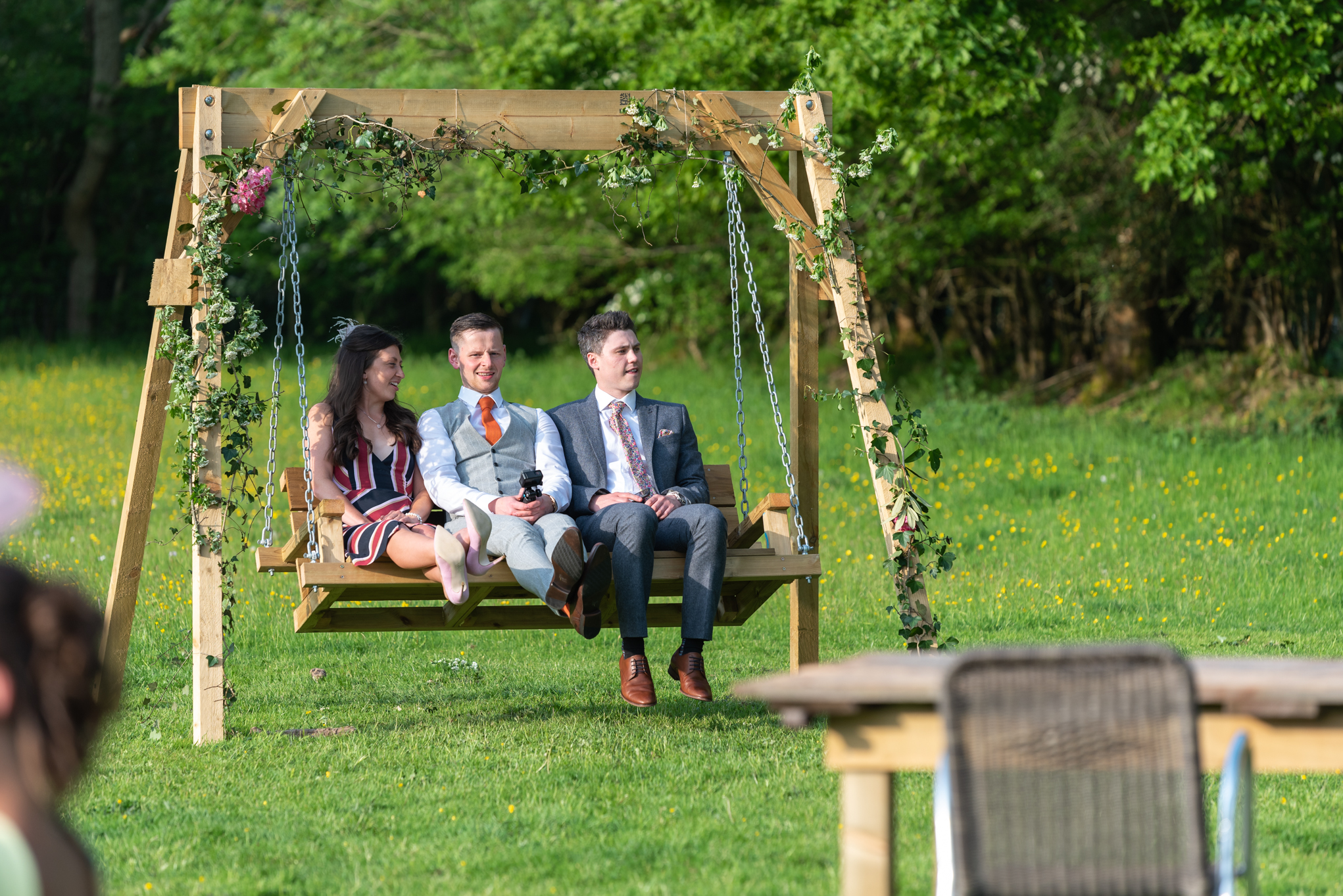 Wedding guests on swing - Powys Wedding Photography
