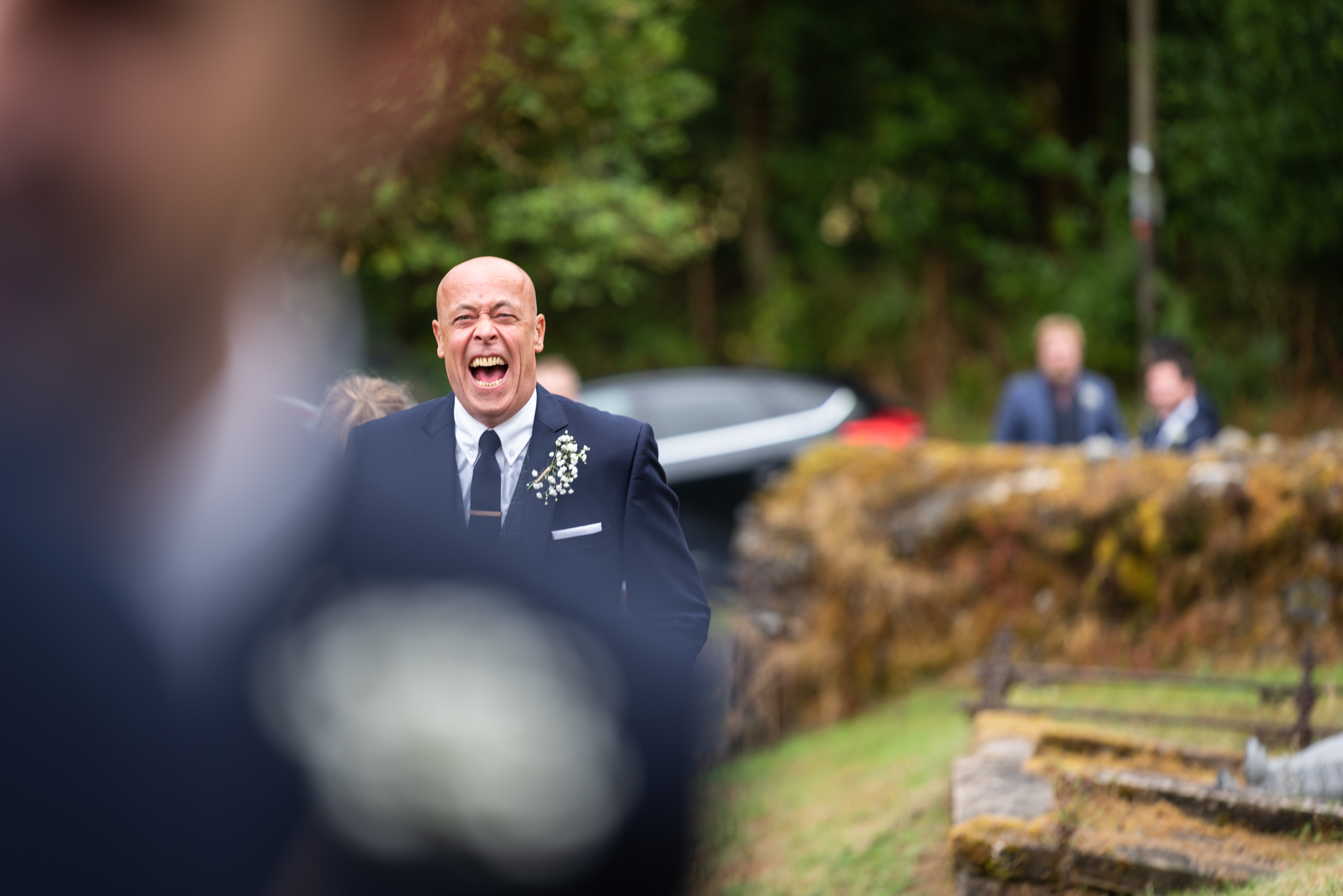 Guests laughing at wedding - Powys Wedding Photography