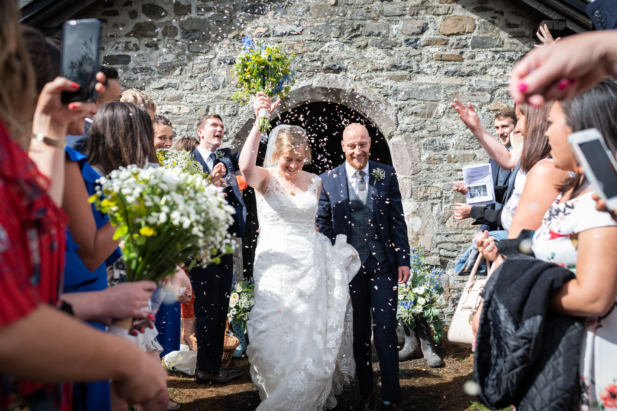 Confetti throwing after wedding - Powys Wedding Photography