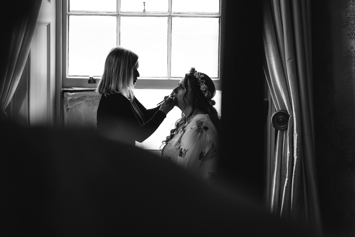 Bride having makeup done