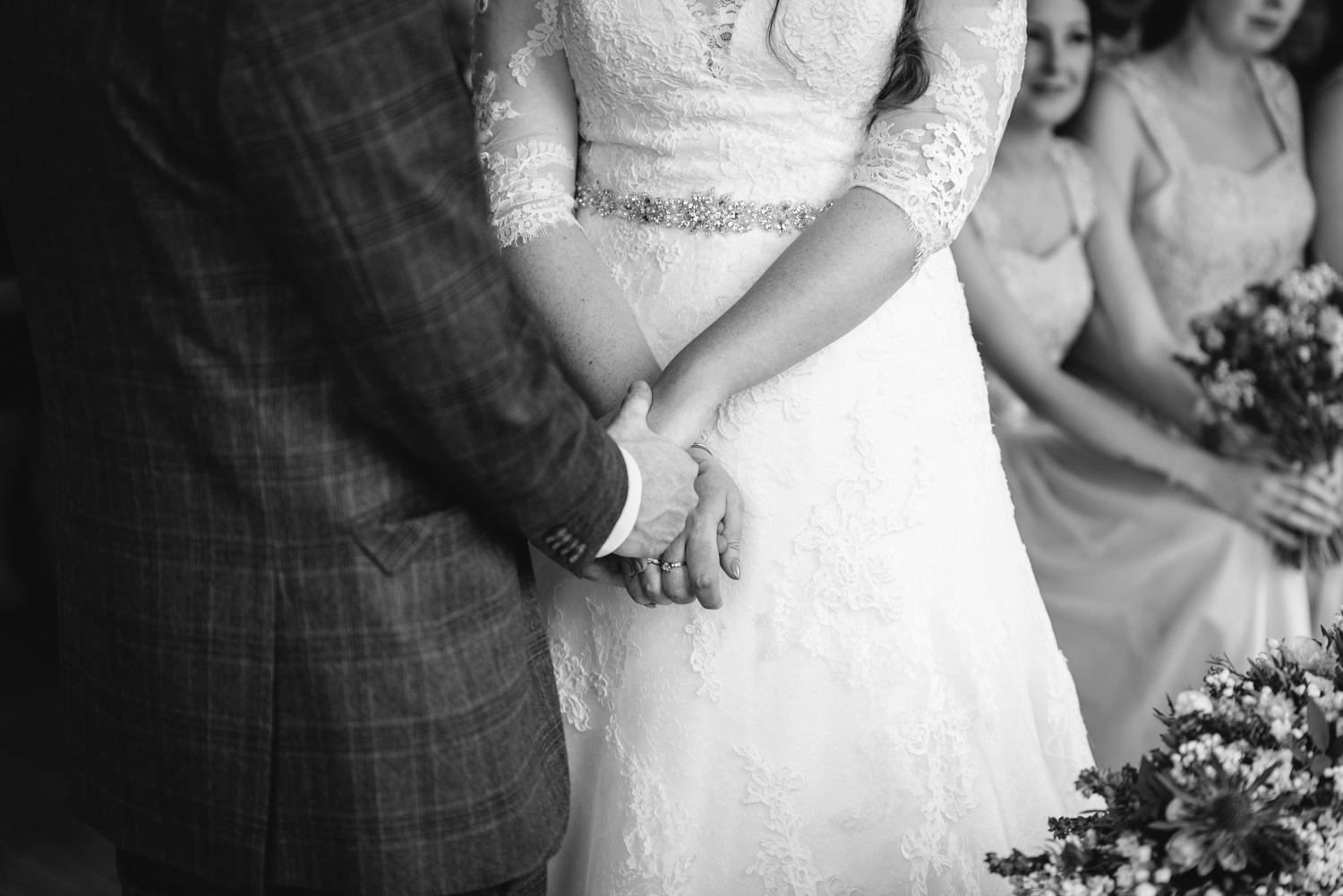bride and groom holding hands