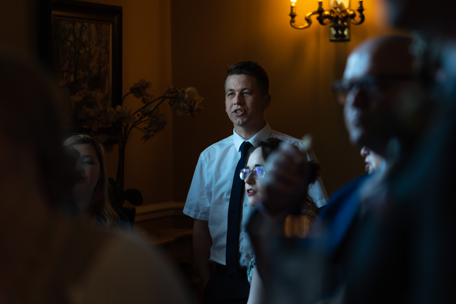 Wedding guest watching rugby