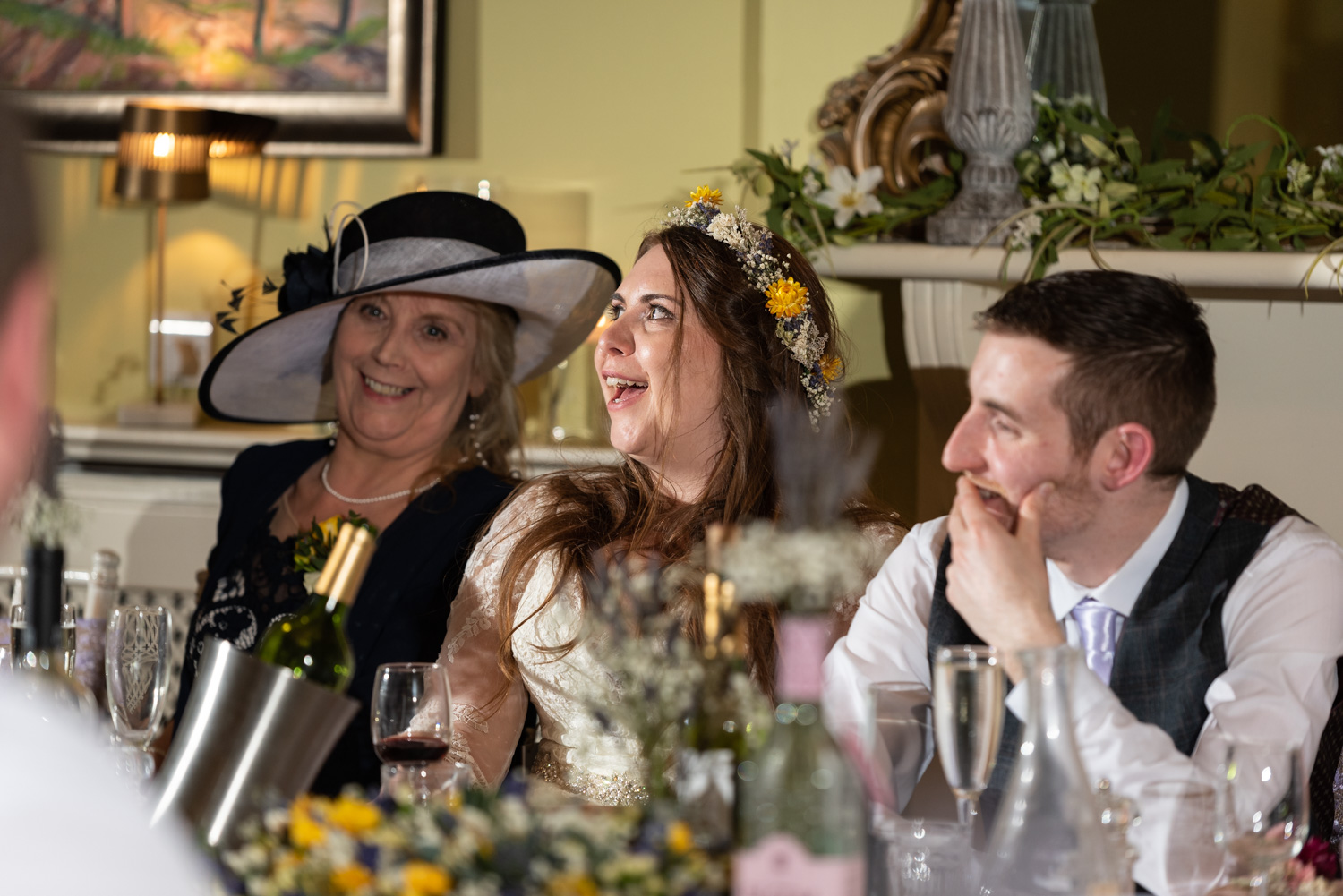 Bride laughing during speeches