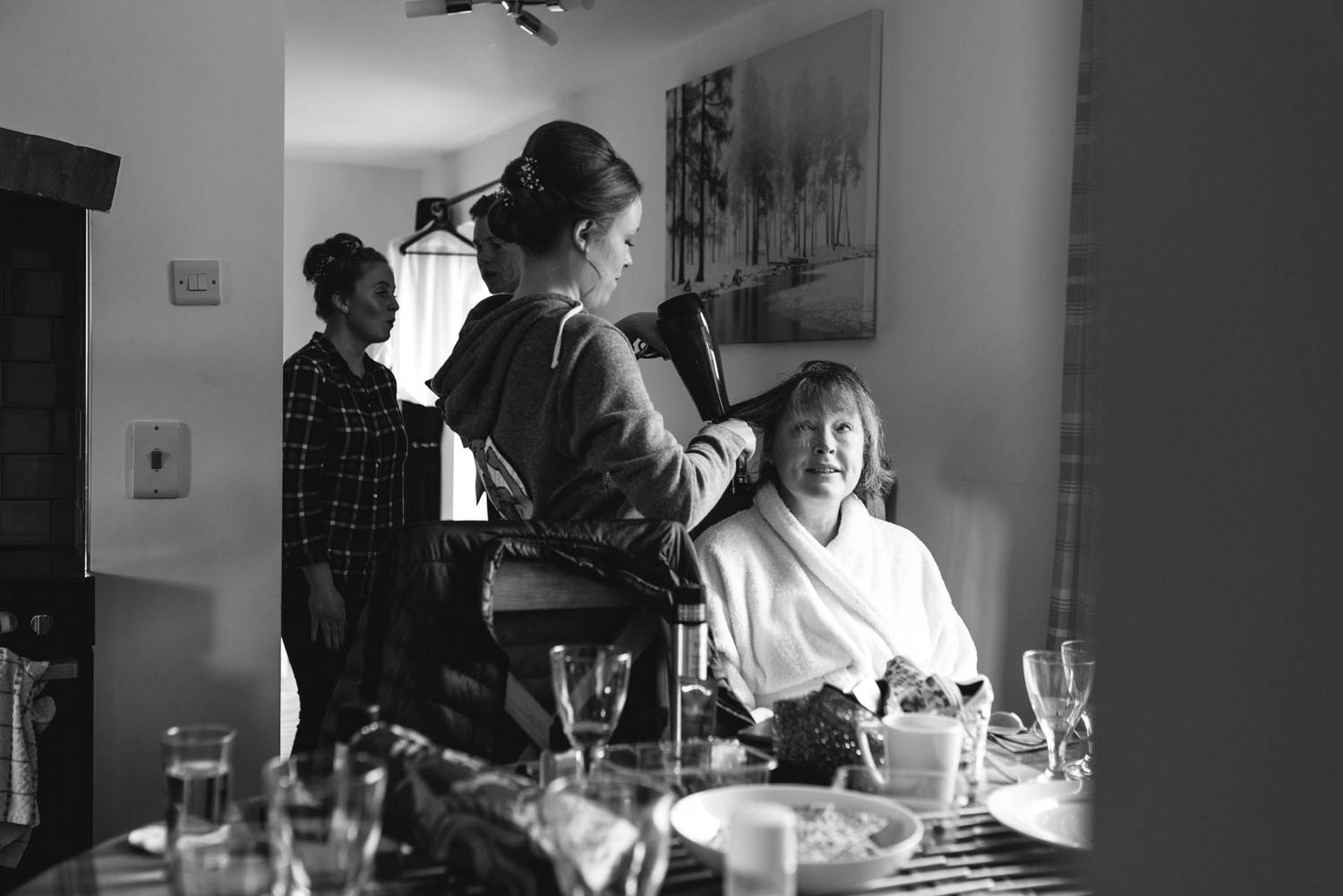 Bride doing mother’s hair