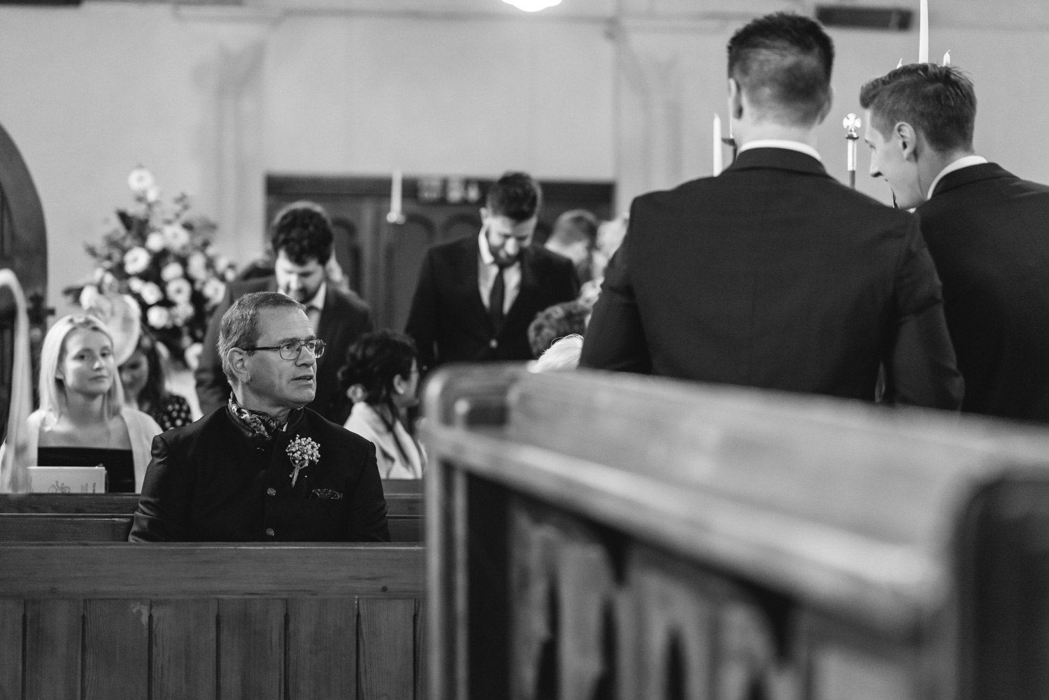 Groom and father talking at church