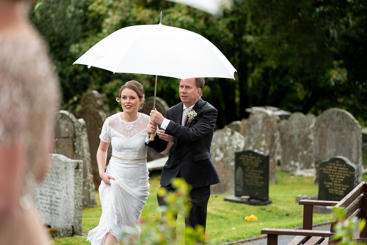 Bride and father walking to church