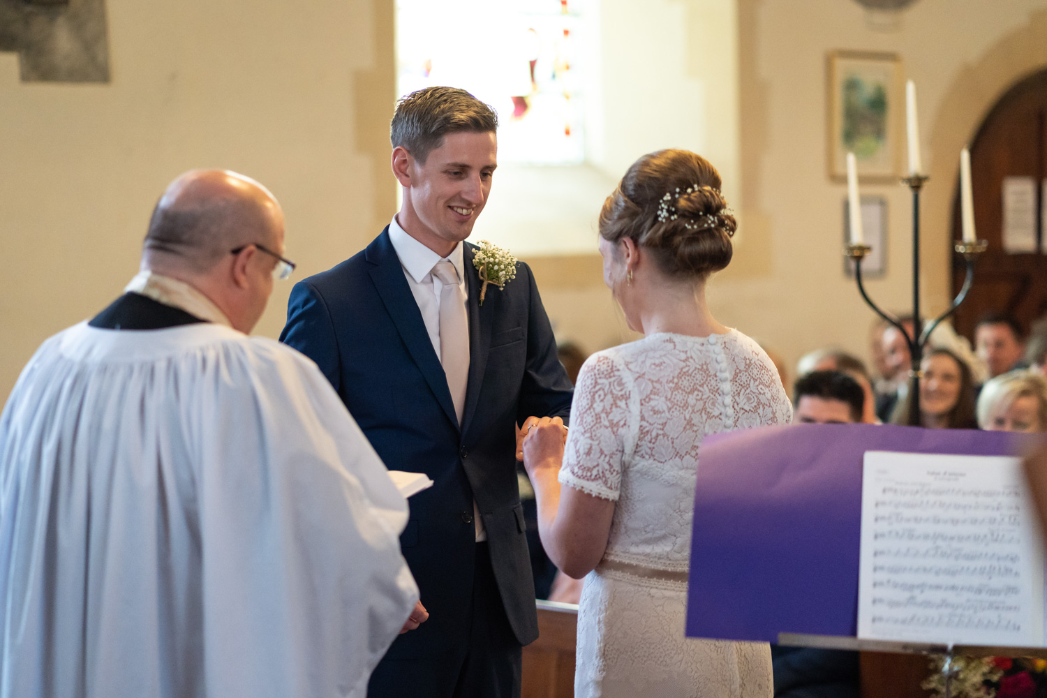 Groom looking at bride