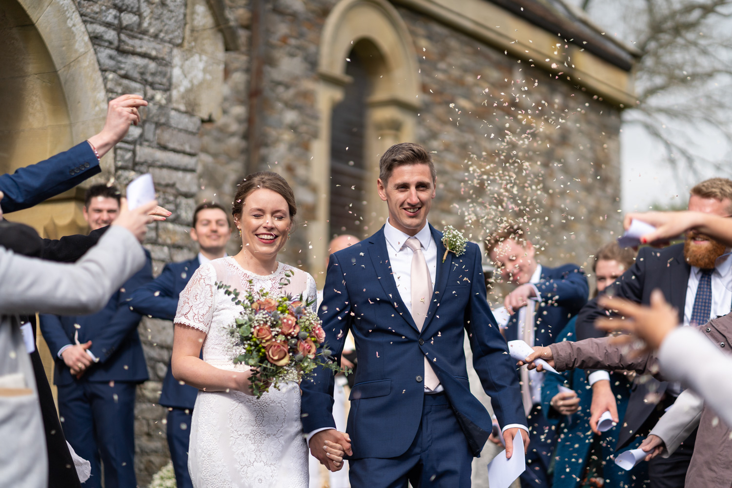 Confetti shot of bride and groom