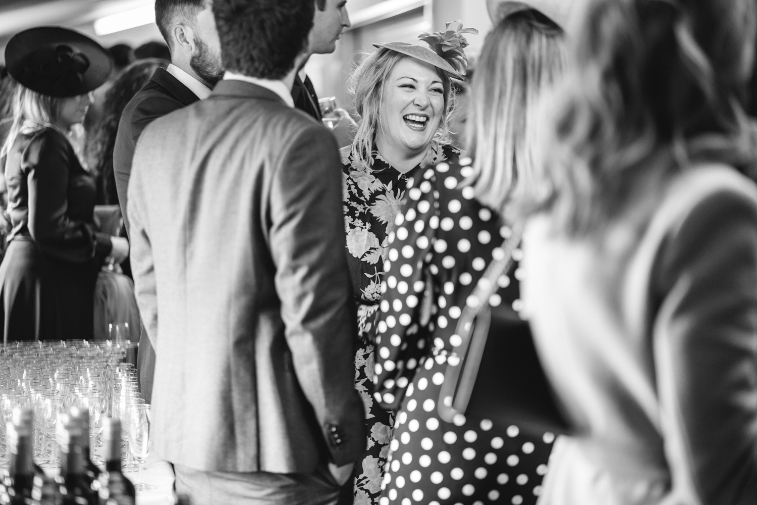 A laughing wedding guest