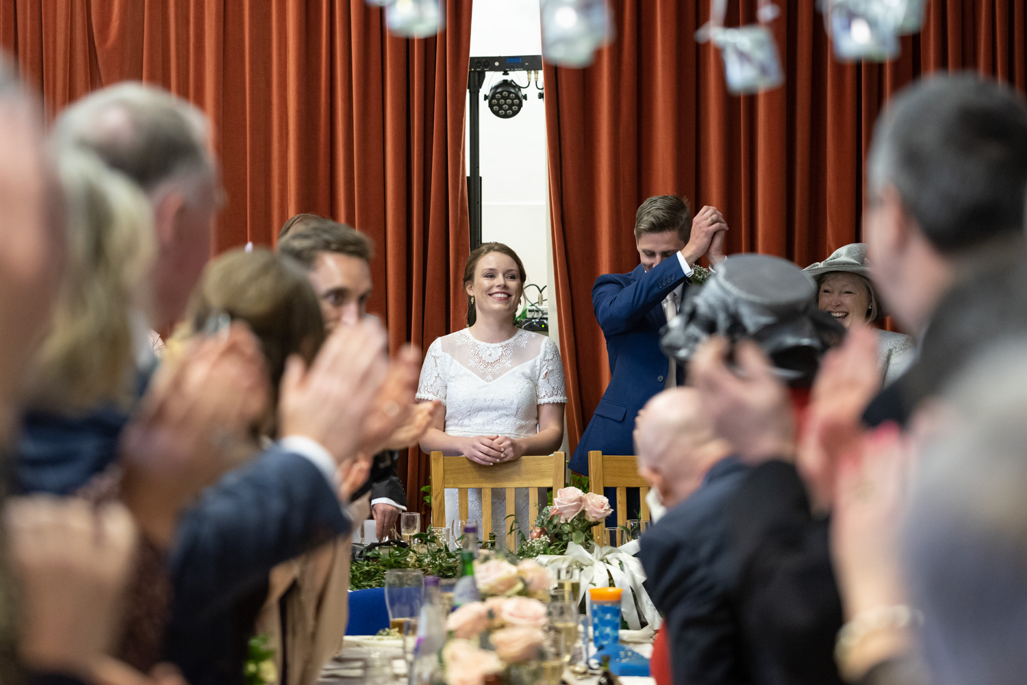 Bride and groom during wedding speeches