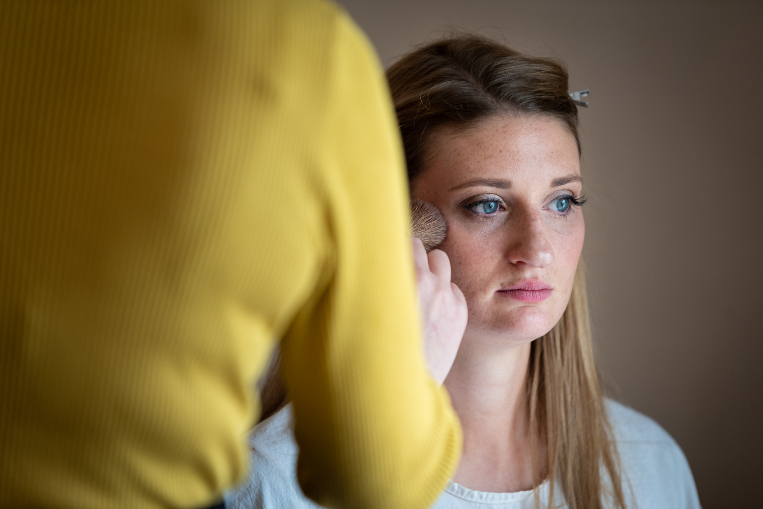 Bride looking serious during make-up