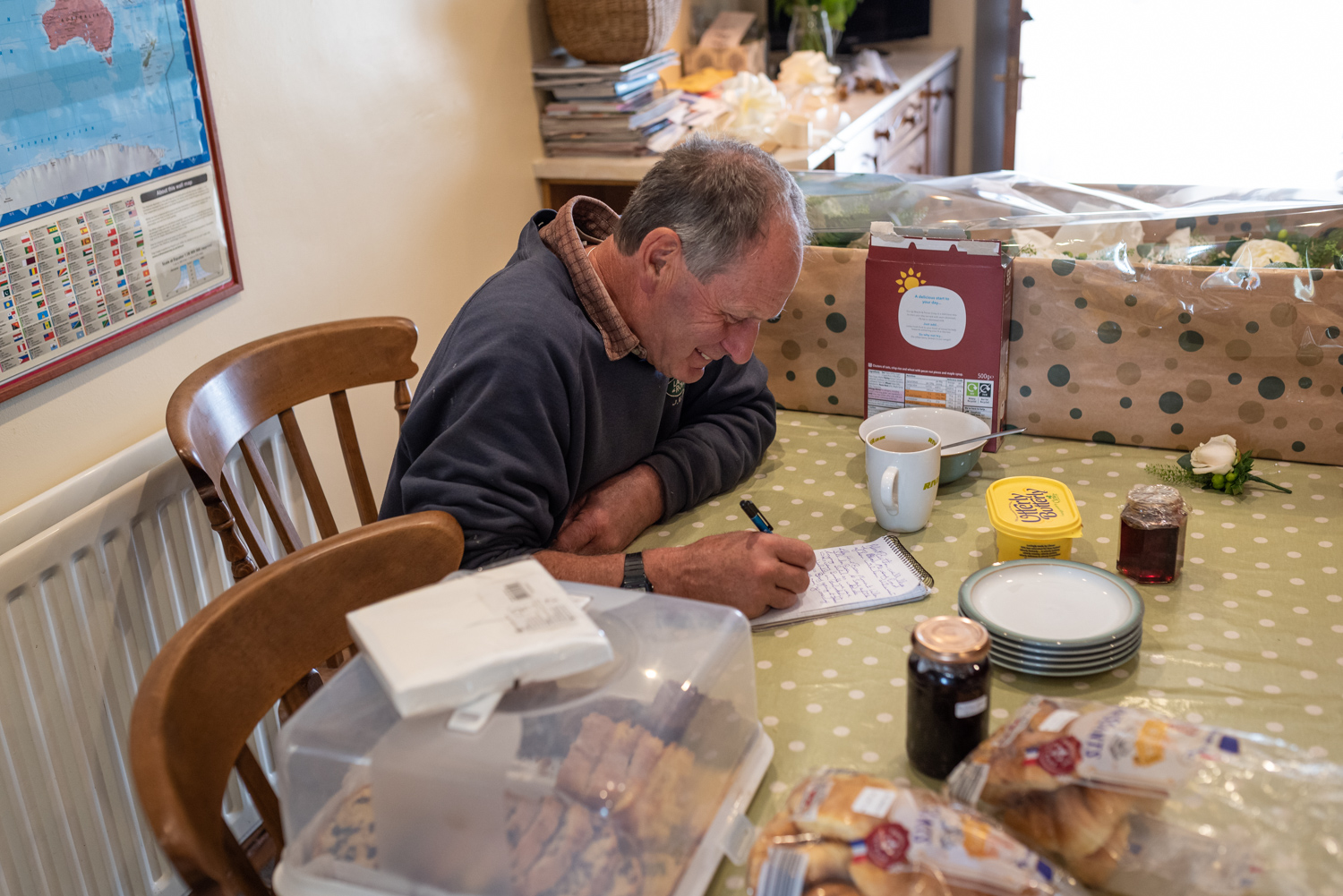Dad writing speech at kitchen table