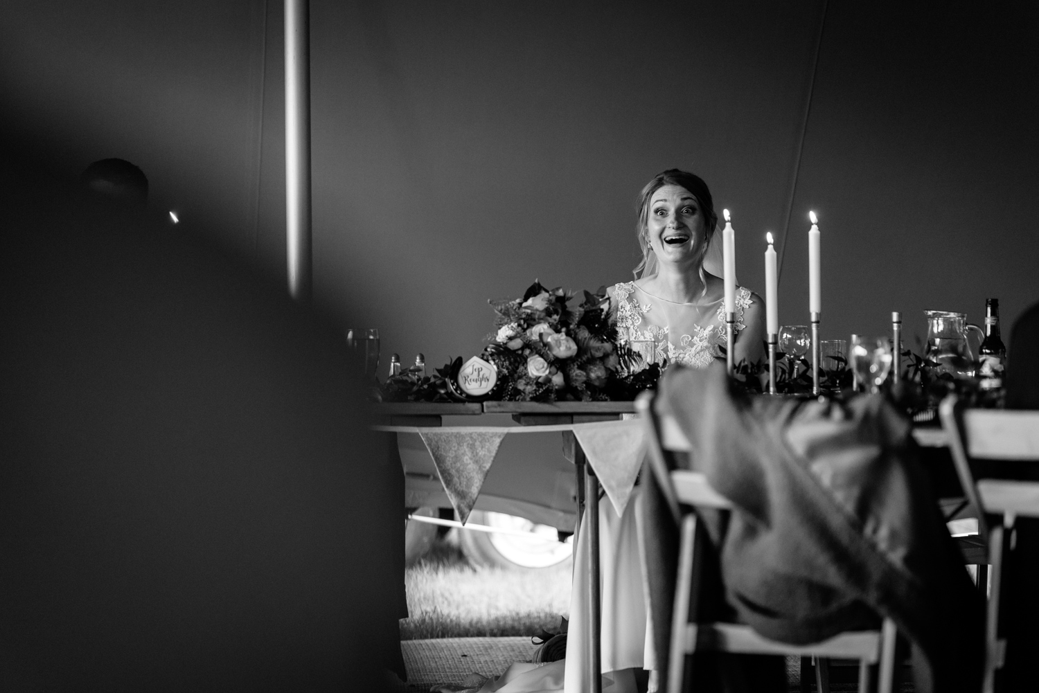 Bride laughing during speeches
