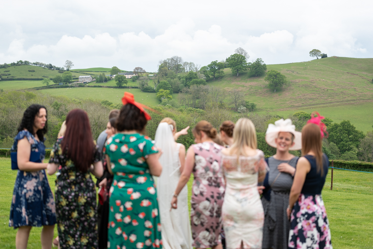 Bride and friends looking at view