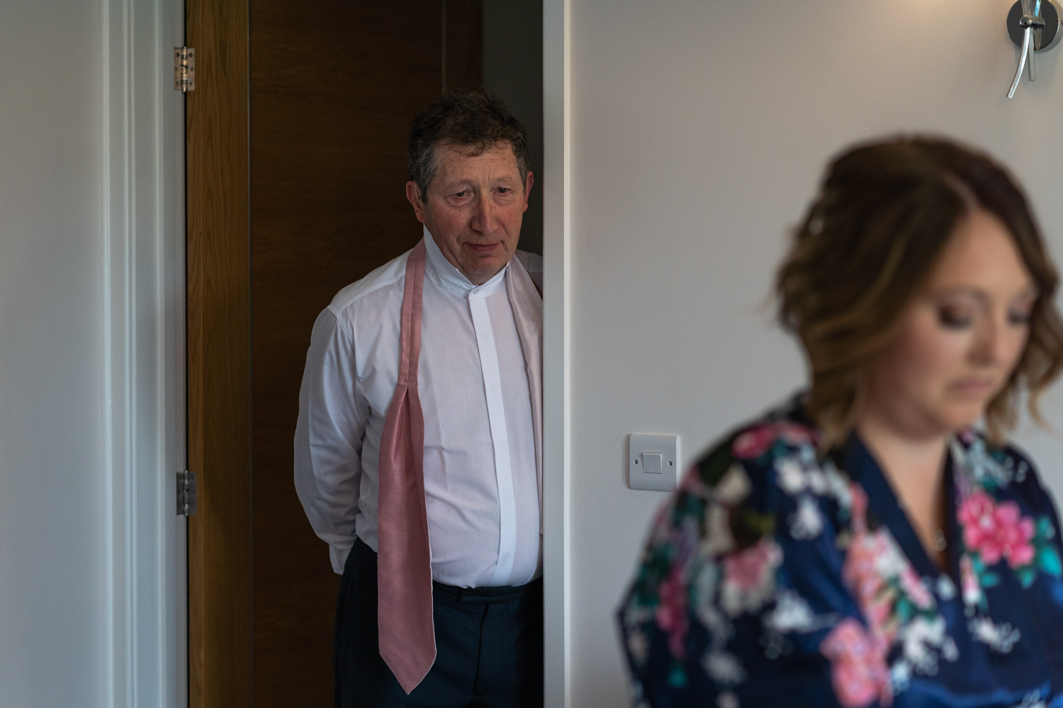 Father of bride looking at bride