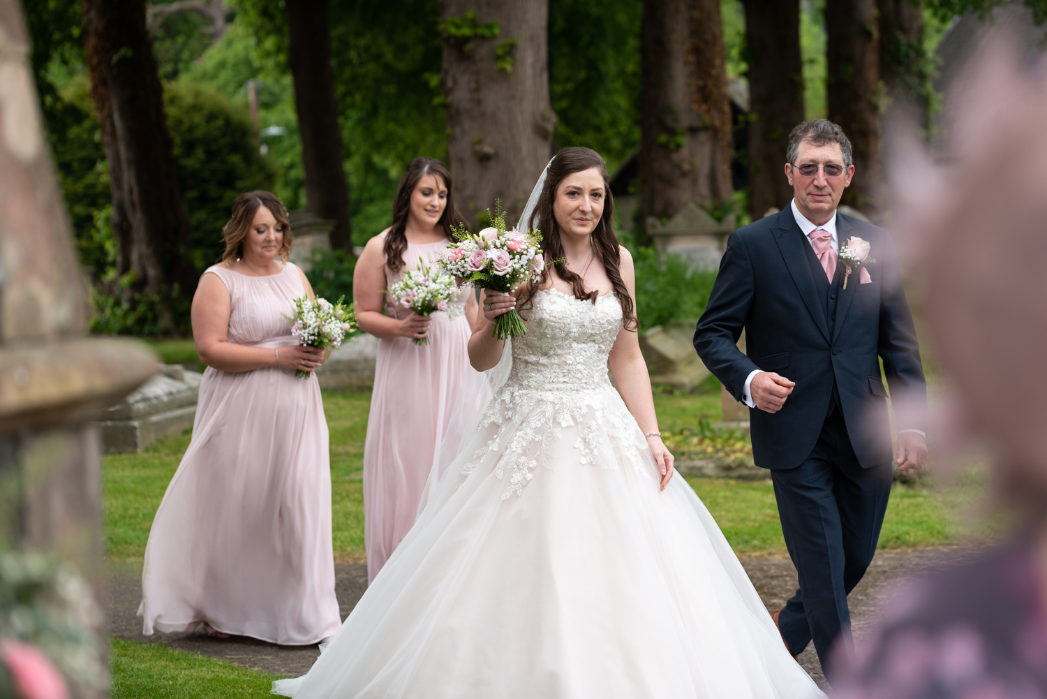 Bride and dad walking to church