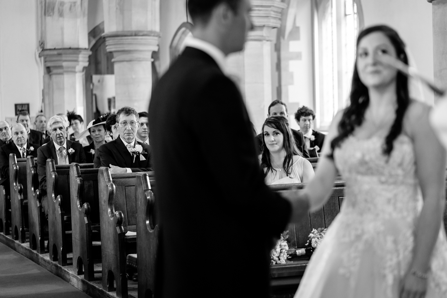 Bridesmaid watching wedding at church