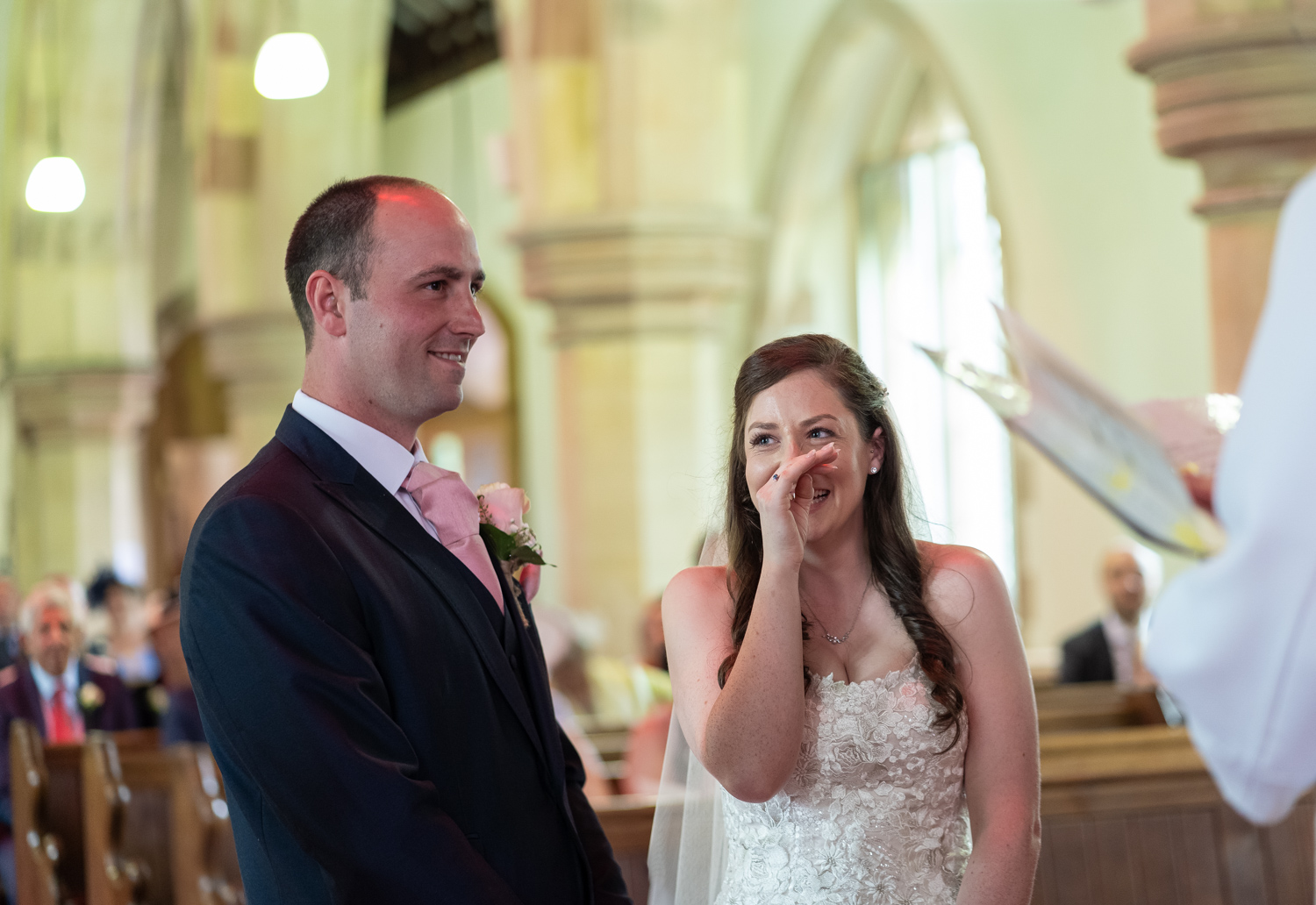 Bride laughing during ceremony