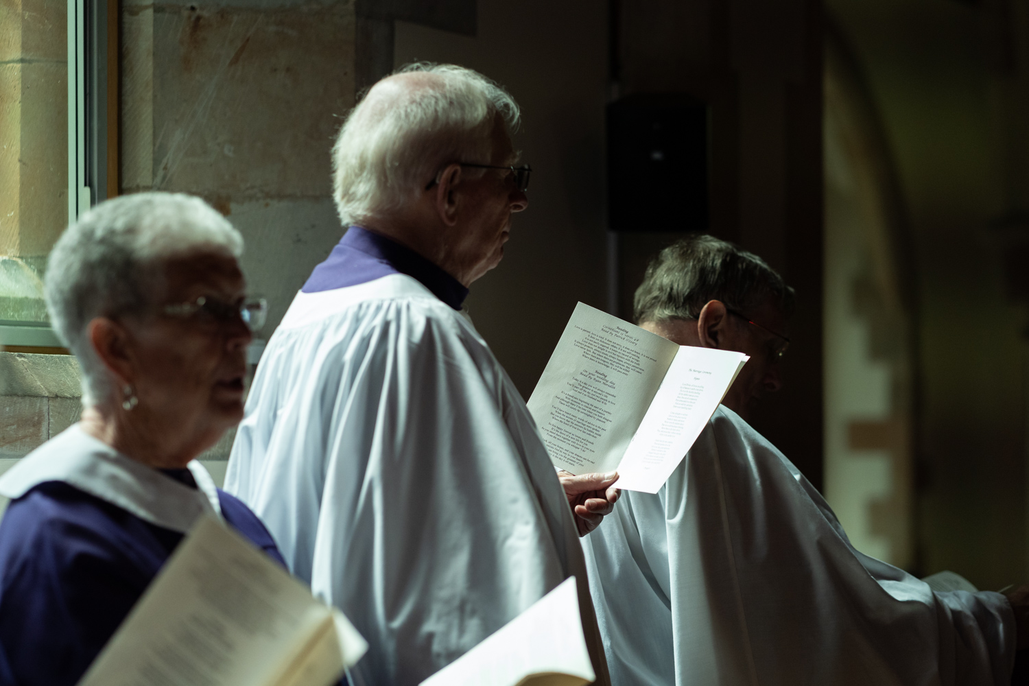 Choir stood singing at church