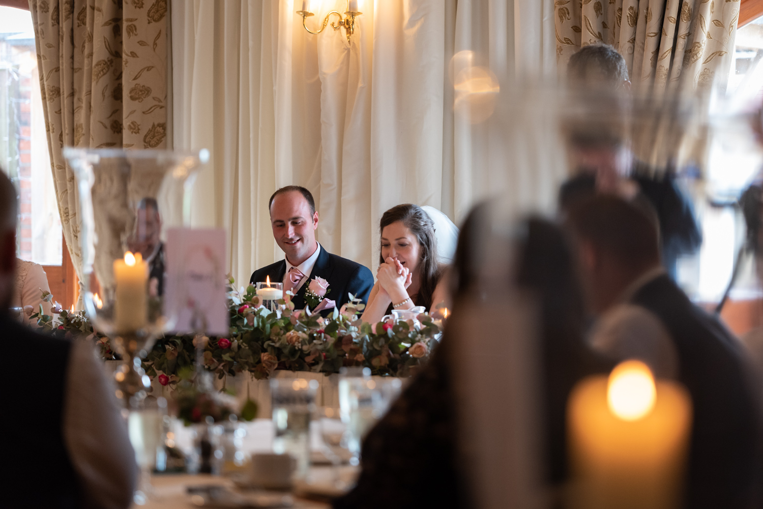 Bride laughing during speeches
