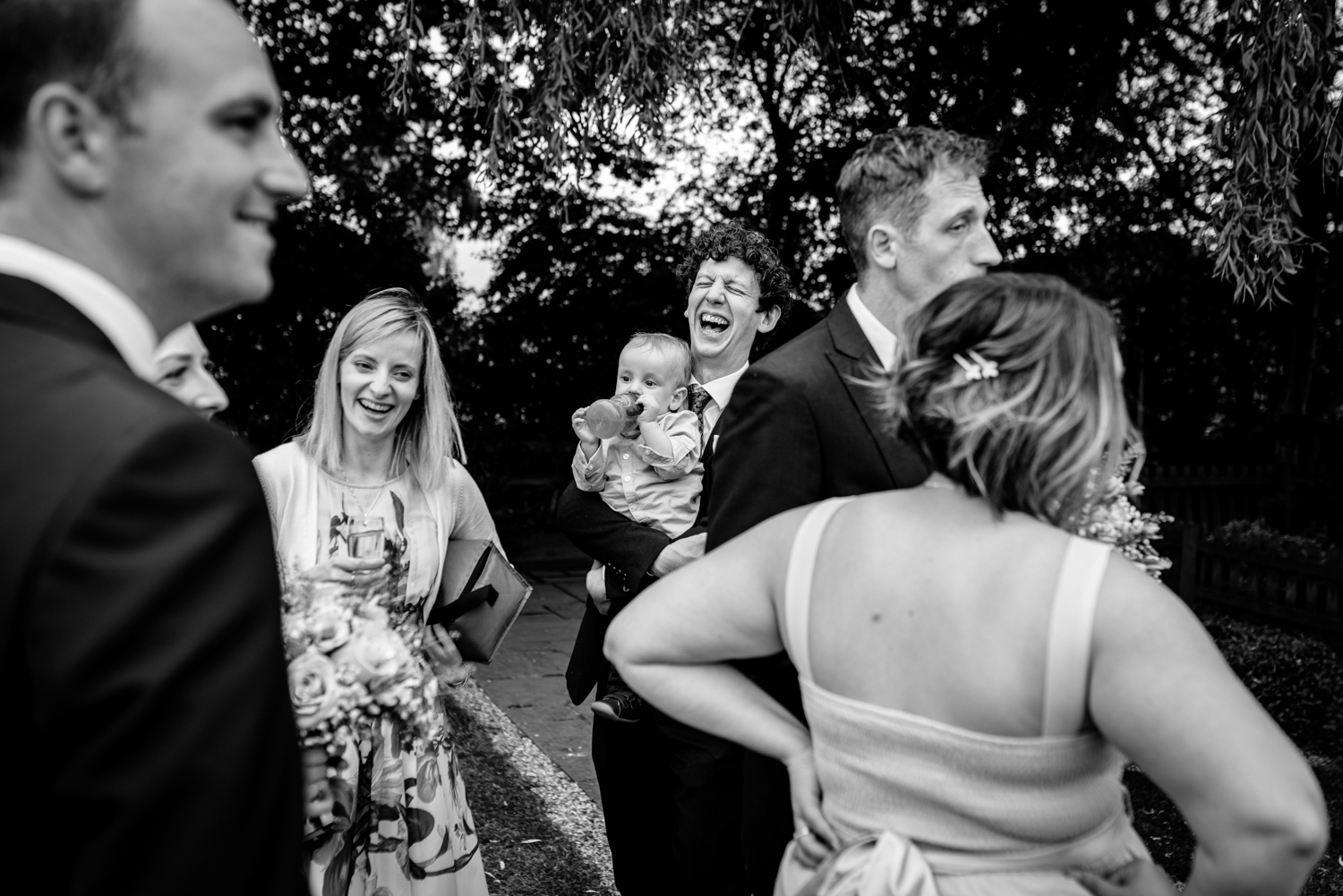 Wedding guests laughing at Albright Hussey