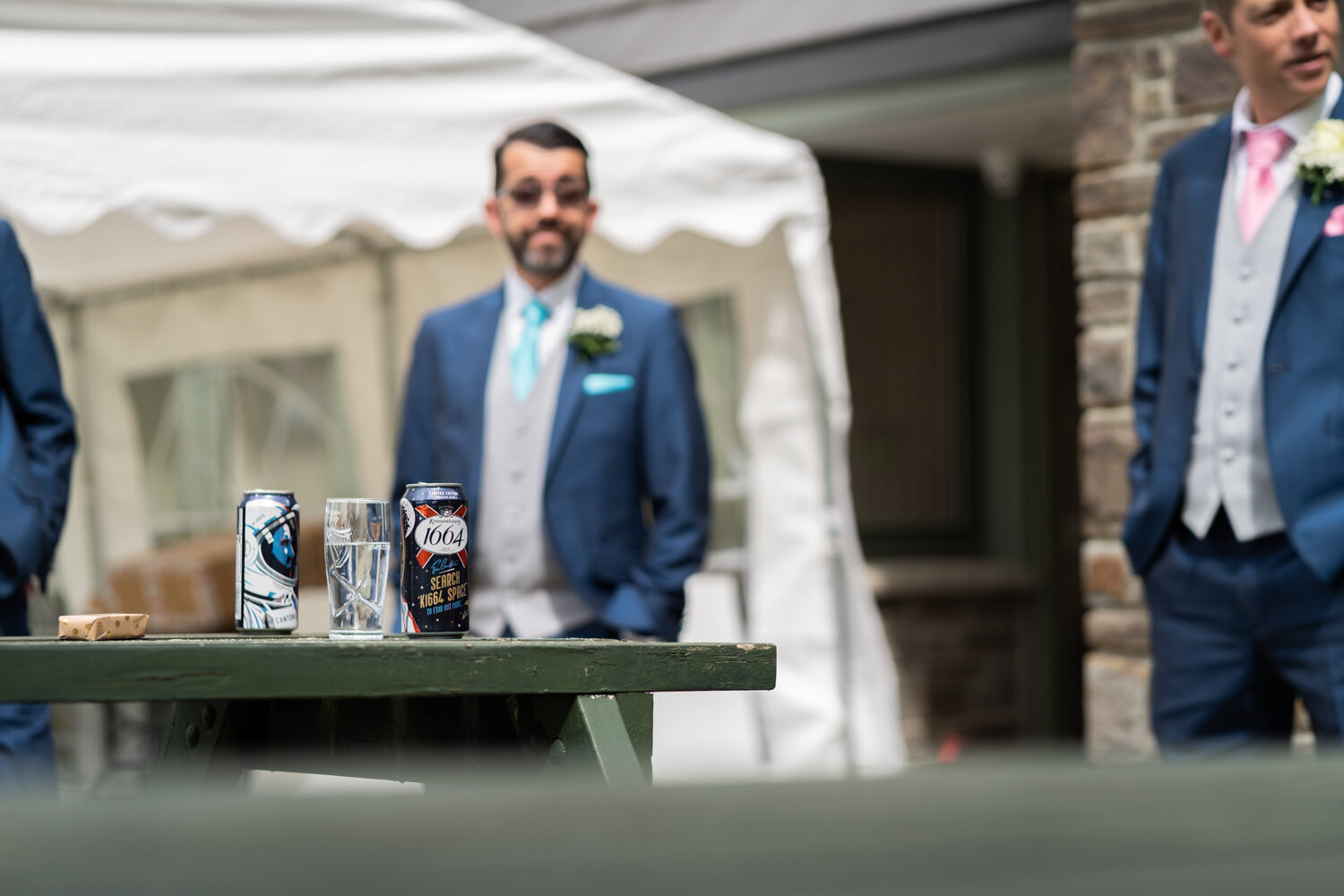 Can of beer and ushers before wedding