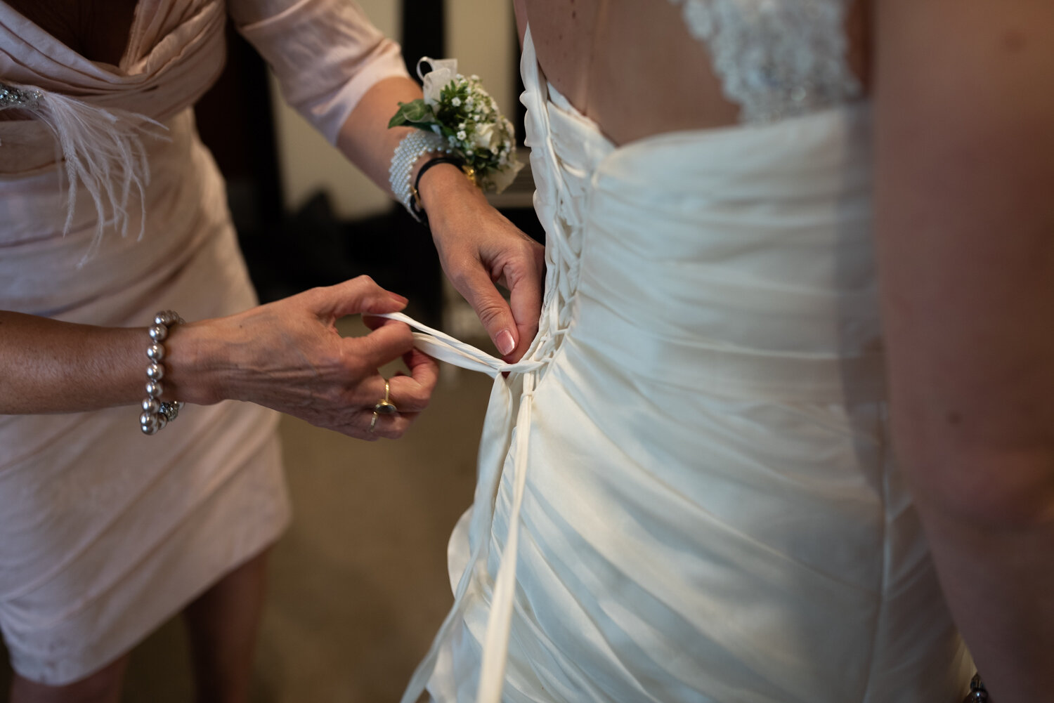 Brides dress being done up