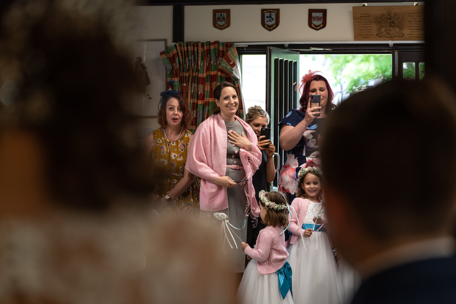 Wedding guests first look at Bride in dress