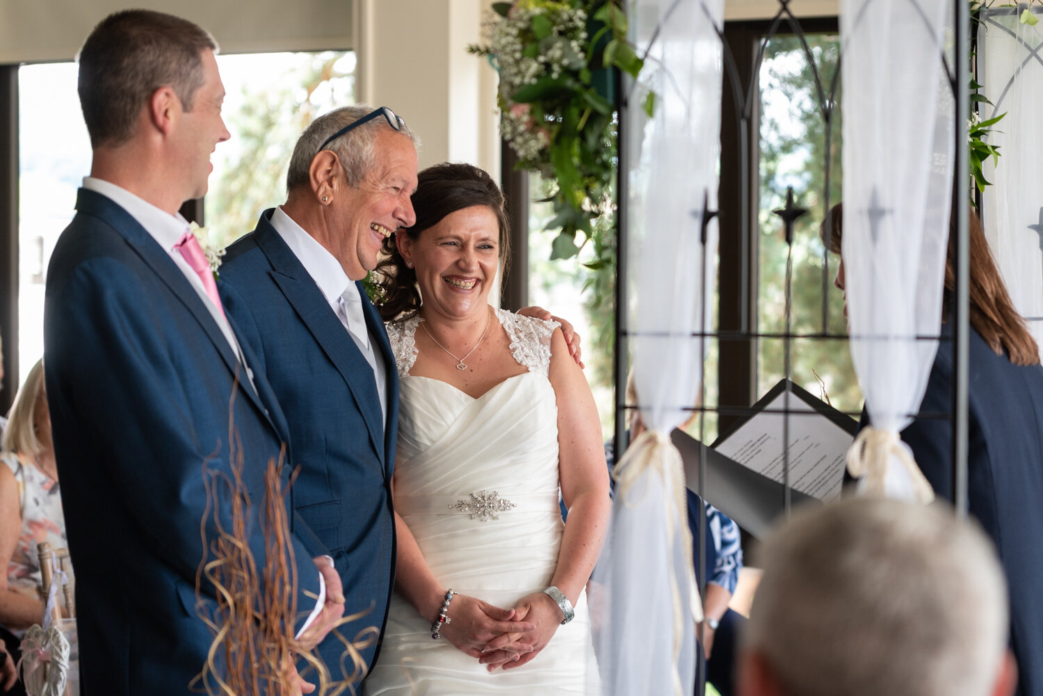 Bride laughing during ceremony