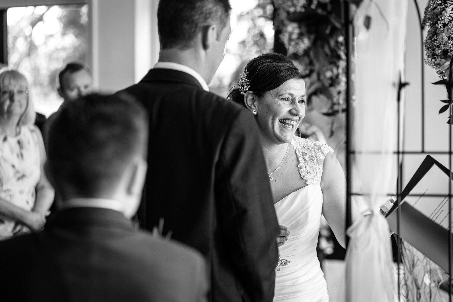 Bride laughing during ceremony