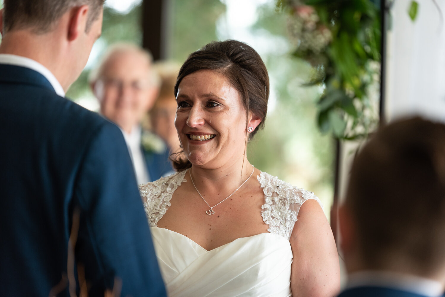 bride with tear running down cheek during ceremony