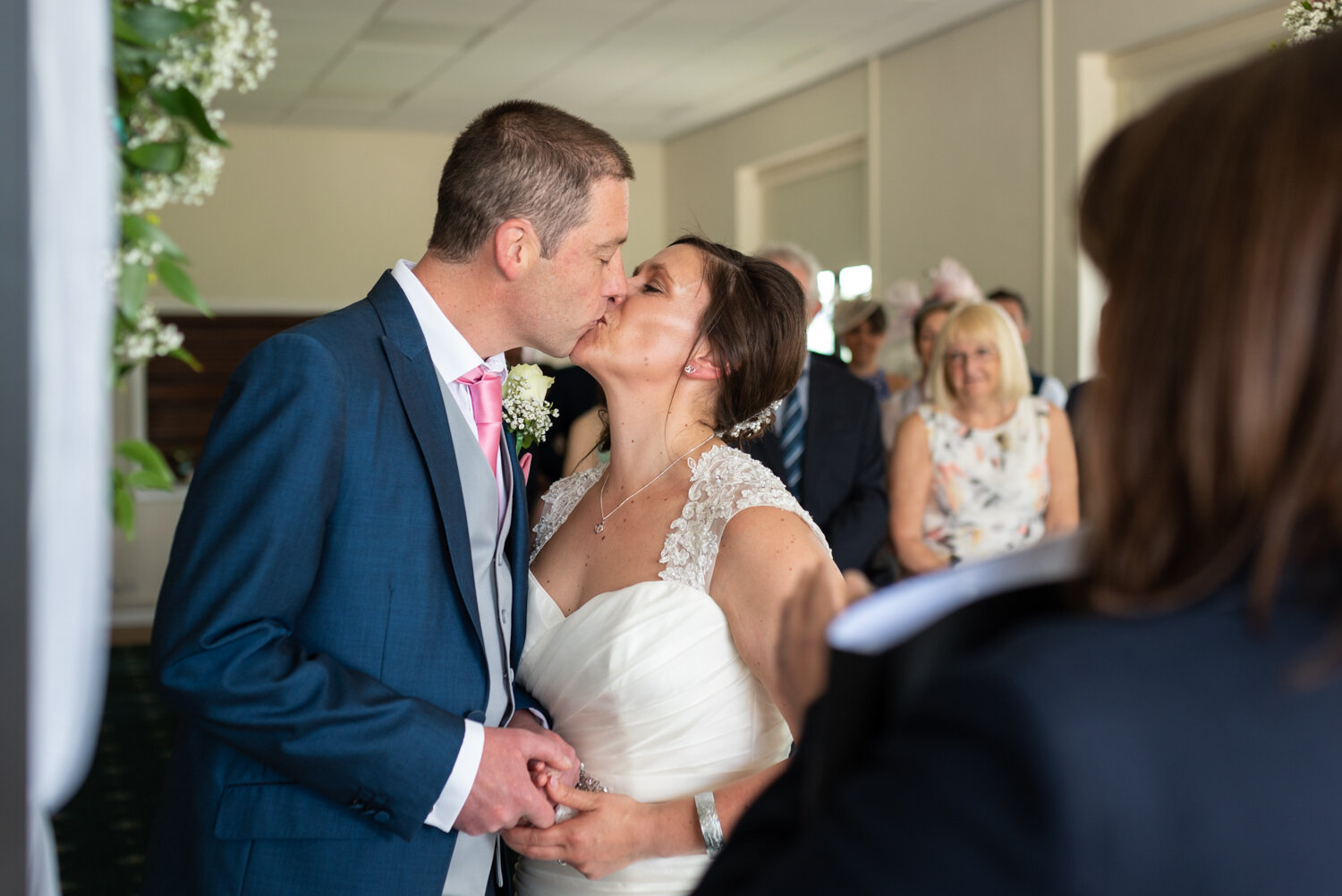 Bride and groom first kiss