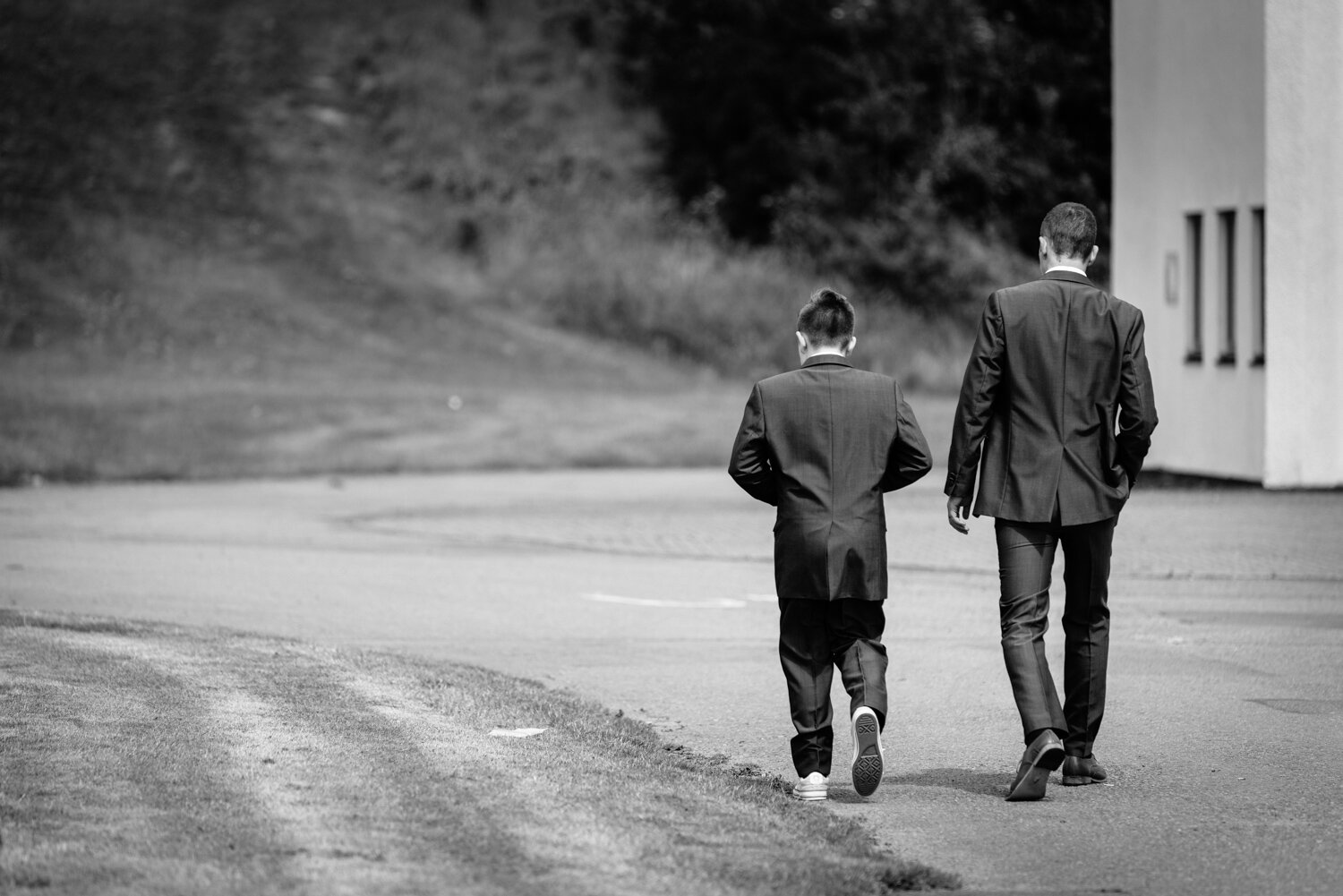 Groom and usher walking away