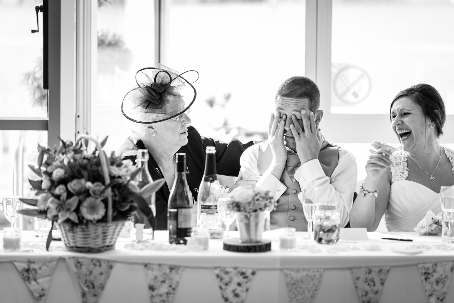 Groom crying and bride laughing